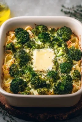 Baked feta pasta with broccoli, garnished and ready to serve in a dish.
