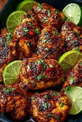 Plate of Chili Lime Chicken garnished with lime slices and cilantro