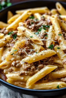 Delicious creamy beef pasta topped with herbs and cheese