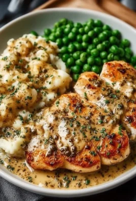 Creamy Boursin chicken bake served in a casserole dish with fresh herbs.