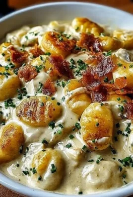 Creamy Crack Chicken Gnocchi served in a bowl with herbs and cheese.