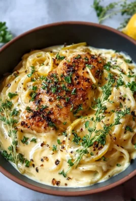 Creamy lemon garlic sauce served over pasta with fresh herbs