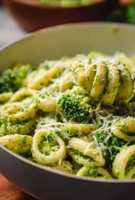 Bowl of easy healthy broccoli pasta garnished with fresh herbs