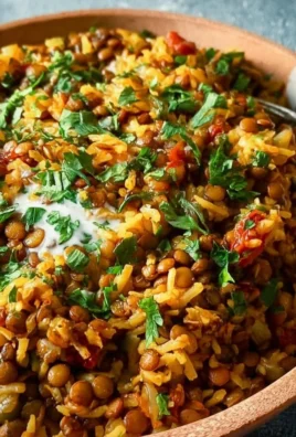 Bowl of easy Mediterranean lentils and rice garnished with fresh herbs