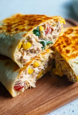 Healthy tuna melt wrap with fresh ingredients on a plate