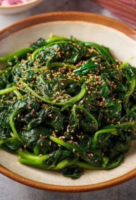 Korean spinach side dish Sigeumchi Namul served in a bowl