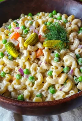 Delicious macaroni salad no mayo in a vibrant bowl, perfect for summer picnics.