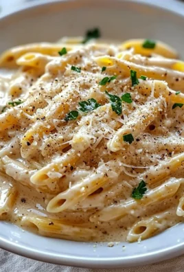 One Pot Creamy Garlic Pasta served in a bowl with fresh herbs on top