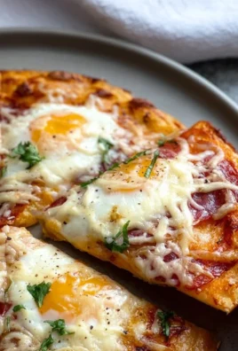 Delicious Pizza Eggs topped with cheese and fresh ingredients