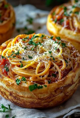 Delicious spaghetti garlic bread bowls filled with pasta and rich garlic flavor