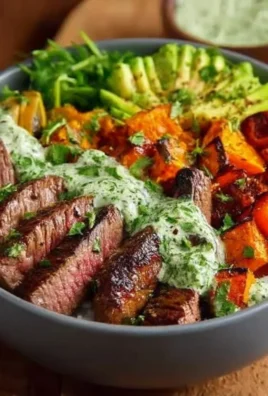 Steak and sweet potato bowls topped with avocado-cilantro drizzle