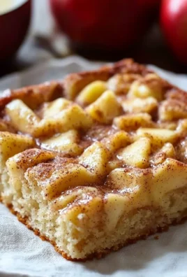 Delicious Apple Cinnamon Sheet Cake with frosting and decorative apples