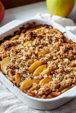 Delicious baked apple crumble dessert with a golden, crispy topping