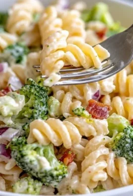 A vibrant bowl of the best broccoli pasta salad with colorful vegetables.