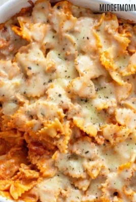 Delicious homemade bow tie pasta lasagna with layers of cheese and sauce