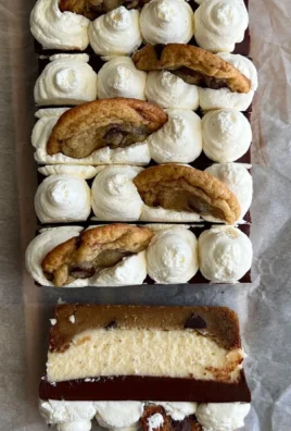 Brown Butter Chocolate Chip Cookie Cheesecake Bars with chocolate chips and creamy cheesecake