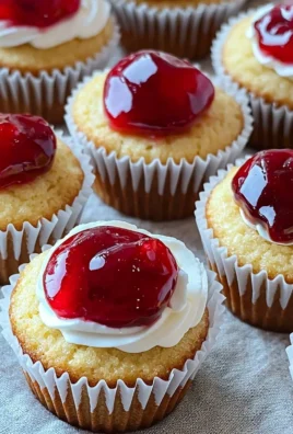 Delicious cherry cheesecake cupcakes topped with fresh cherries and cream cheese frosting.