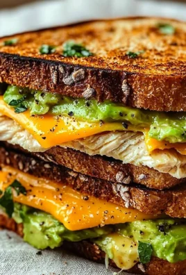 Delicious Chicken Avocado Melt Sandwich with melted cheese and fresh ingredients