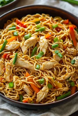 Bowl of Chicken Chow Mein with vegetables and tender chicken pieces