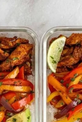 Delicious chicken fajita meal prep bowls with colorful vegetables and spices