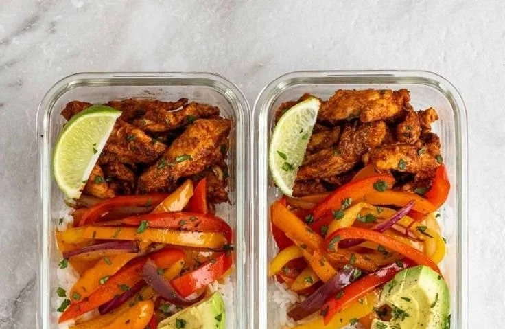 Delicious chicken fajita meal prep bowls with colorful vegetables and spices
