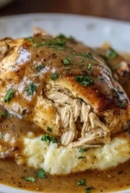 Crockpot Chicken and Gravy served on a plate with vegetables