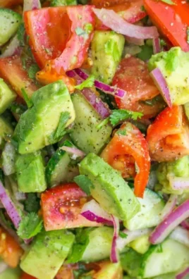 Fresh Cucumber Tomato Avocado Salad with colorful vegetables and healthy ingredients
