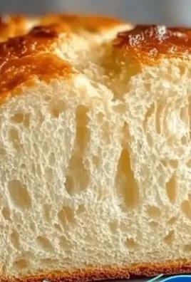 Freshly baked zero carb yogurt bread served on a wooden cutting board.