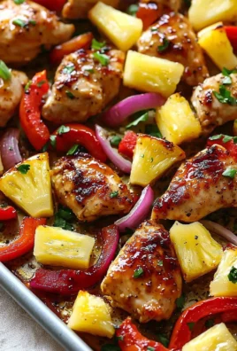 Hawaiian chicken sheet pan meal with colorful vegetables