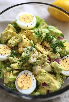 Delicious herby avocado egg salad served in a bowl for a quick lunch option.