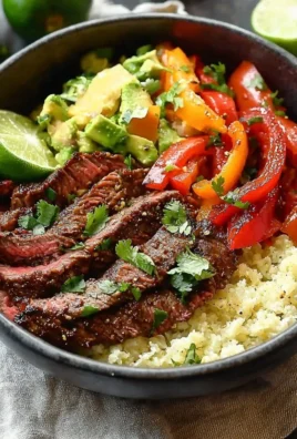 High protein steak fajita bowl with colorful vegetables and spices