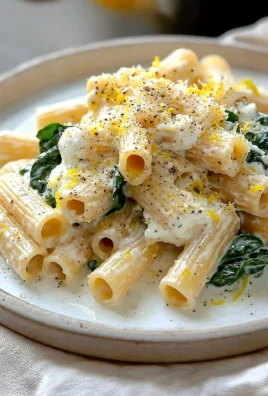 Creamy Lemon Ricotta Pasta garnished with fresh herbs