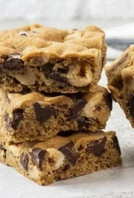 Original NESTLÉ® TOLL HOUSE® chocolate chip cookie bars on a baking tray