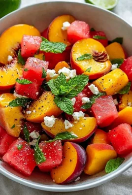 A vibrant and colorful refreshing summer salad served in a bowl