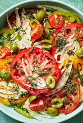 Fresh ingredients in a Simple Tomato Salad dish garnished with herbs