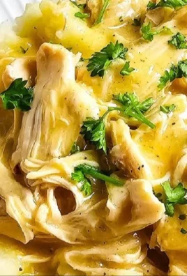 Delicious slow cooker chicken and gravy served with mashed potatoes.