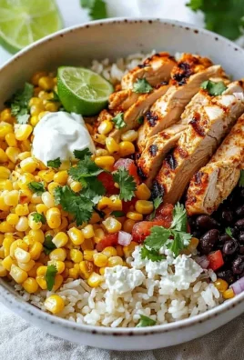 Healthy street corn chicken rice bowl with vibrant toppings.