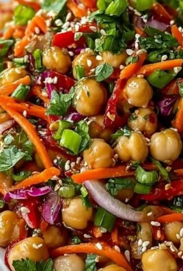 Vibrant chickpea salad with fresh vegetables and dressing