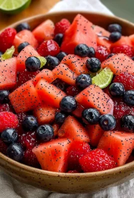 Watermelon Summer Berry Salad with fresh berries and mint leaves